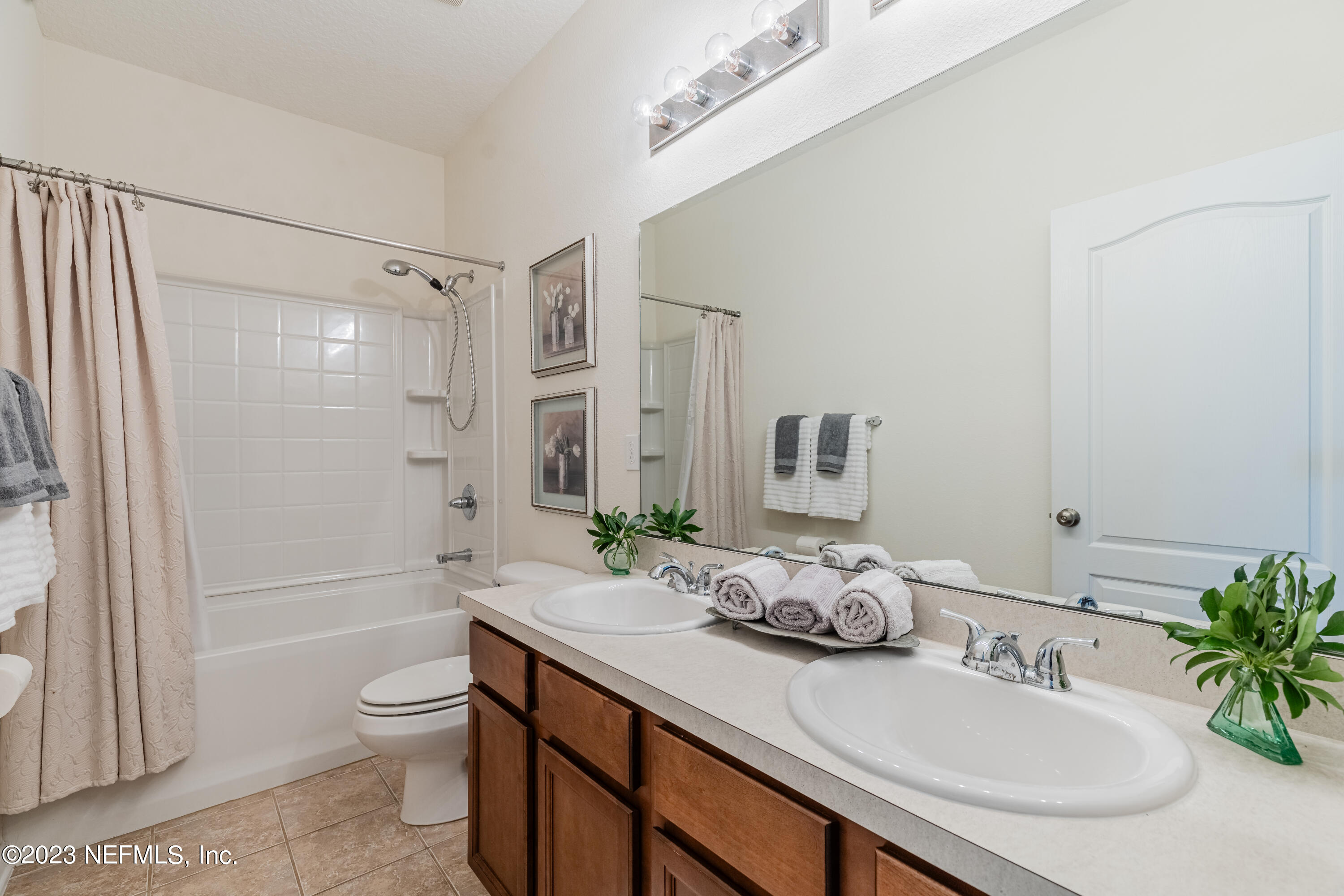 800 Eagle Cove Drive Fleming Island, FL 32003 - Photo 22 of 99 a bathroom with a granite countertop sink a toilet and shower