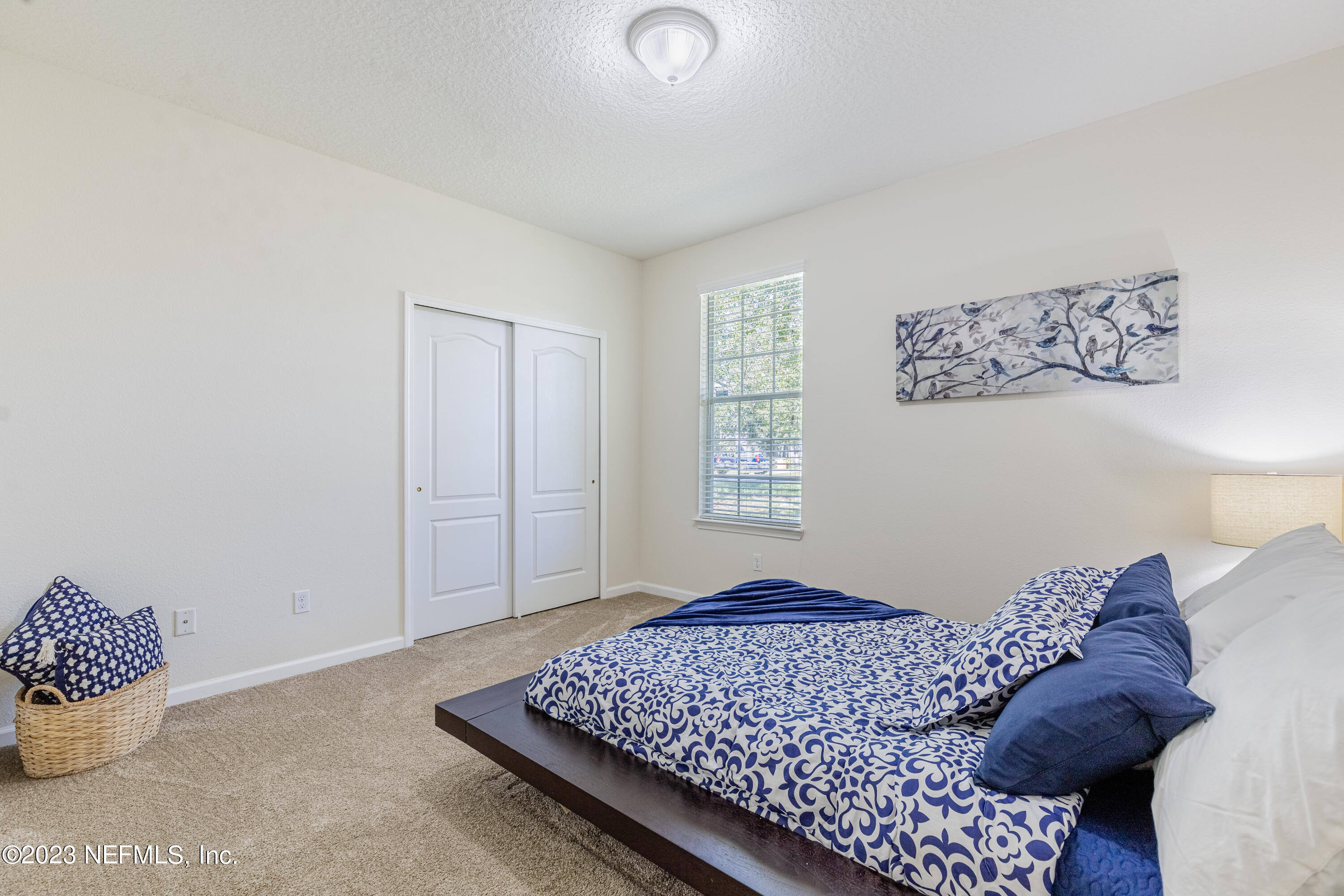 800 Eagle Cove Drive Fleming Island, FL 32003 - Photo 23 of 99 a bedroom with a bed and a window