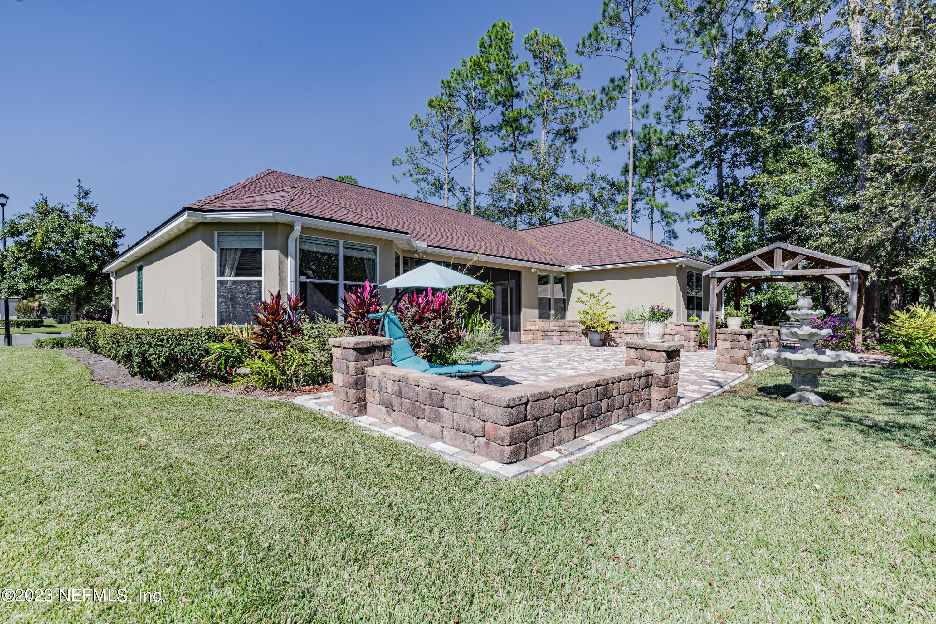800 Eagle Cove Drive Fleming Island, FL 32003 - Photo 32 of 99 a front view of a house with garden