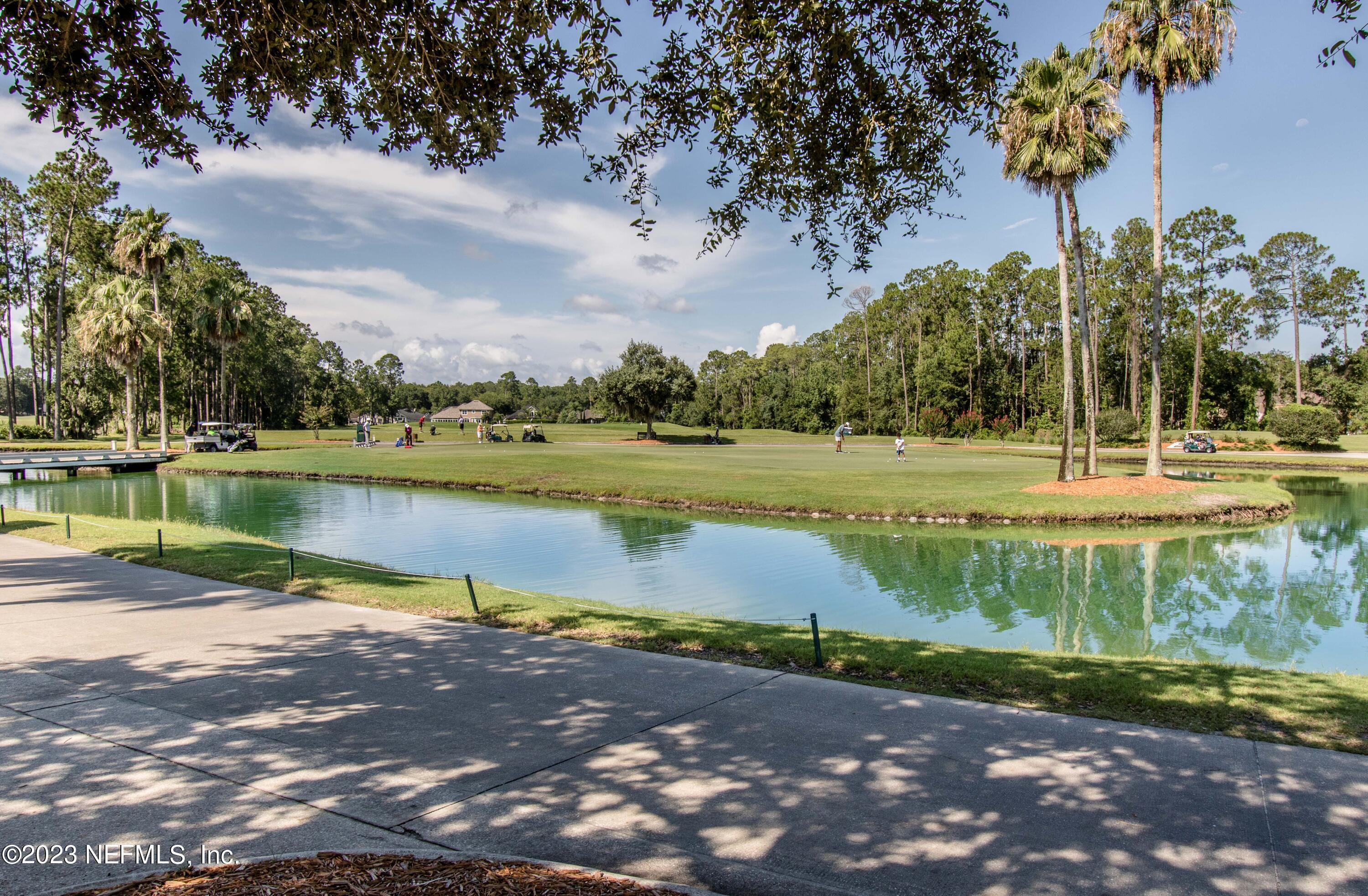 800 Eagle Cove Drive Fleming Island, FL 32003 - Photo 97 of 99 a view of a lake with a big yard
