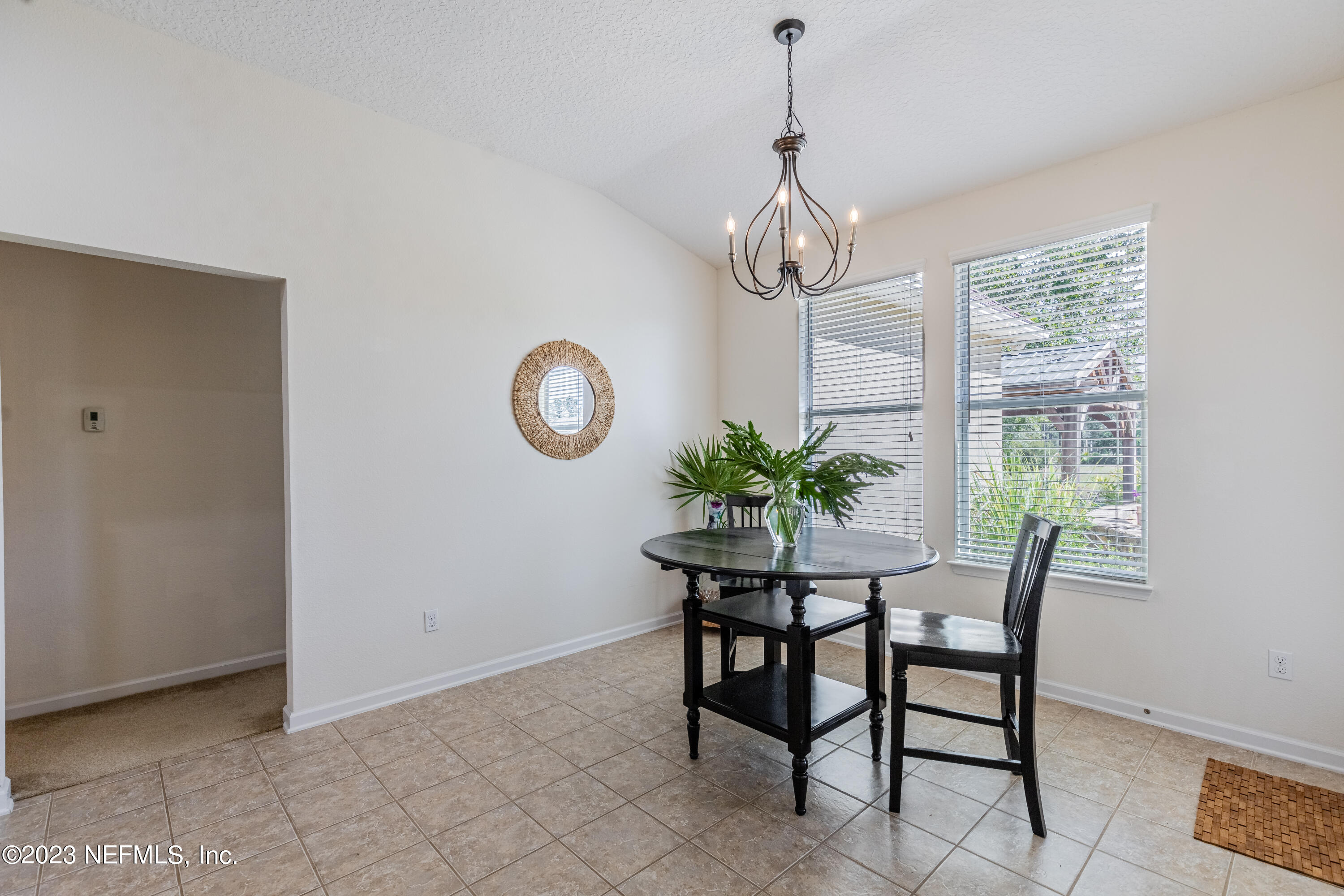 800 Eagle Cove Drive Fleming Island, FL 32003 - Photo 10 of 99 a view of a dining room with a table and chairs