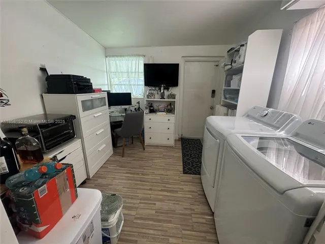 a kitchen with stainless steel appliances a stove a sink and cabinets