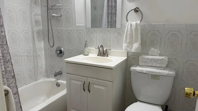 a bathroom with a shower and a sink