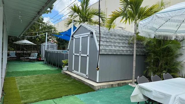 a kitchen with a refrigerator and a stove