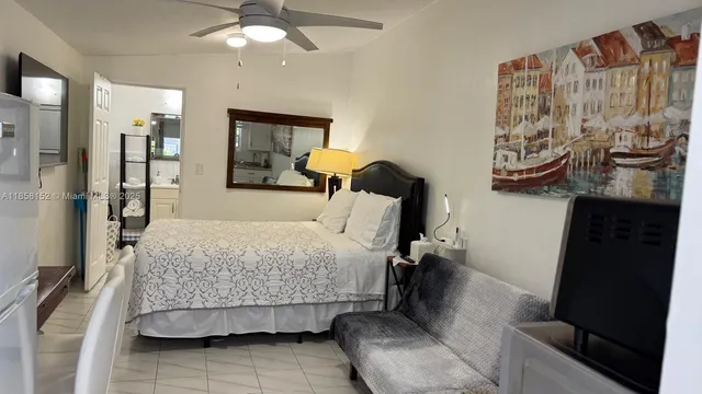 a bathroom with a sink a toilet and shower curtain