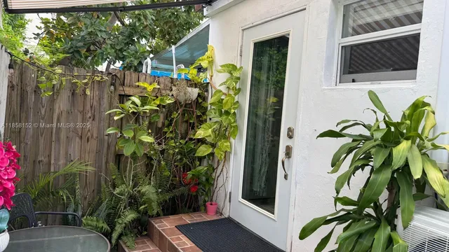 a bedroom with a bed and a night stand