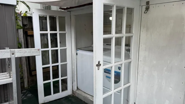 a bathroom with a granite countertop toilet sink and mirror