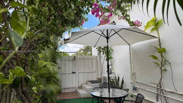 a kitchen with stainless steel appliances a stove refrigerator and microwave