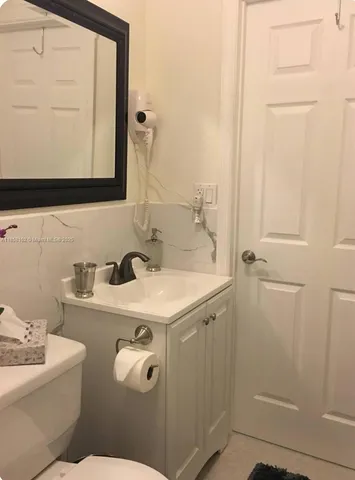 a bedroom with a bed and a walk in closet