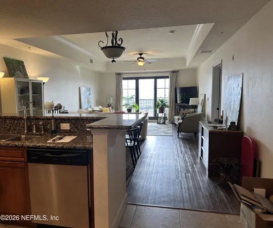 a kitchen with counter top space a sink appliances and cabinets