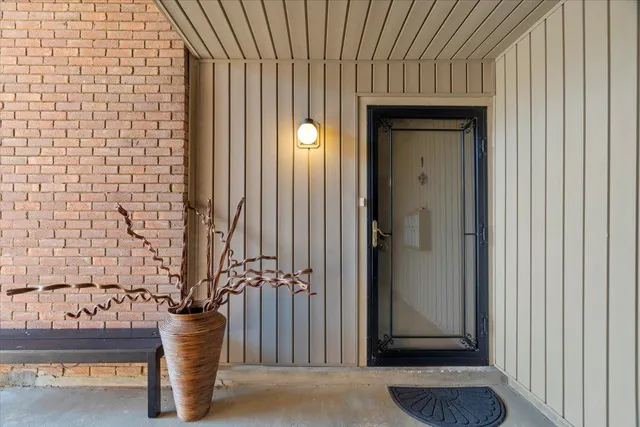 a view of a house with a door and wooden floor
