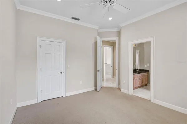 a view of an empty room and a bathroom
