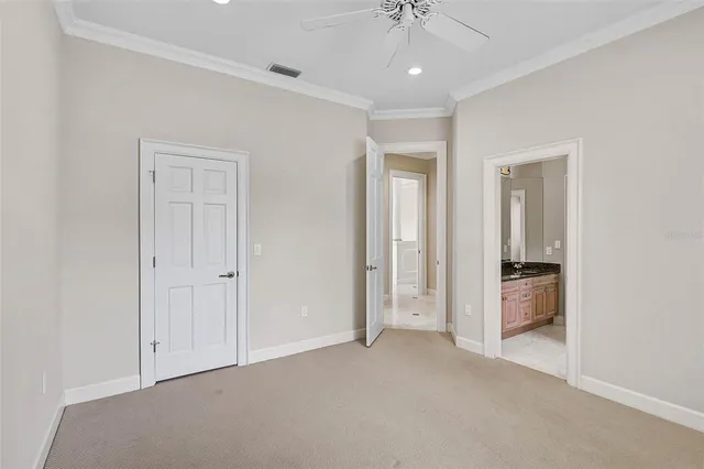 a view of an empty room and a bathroom
