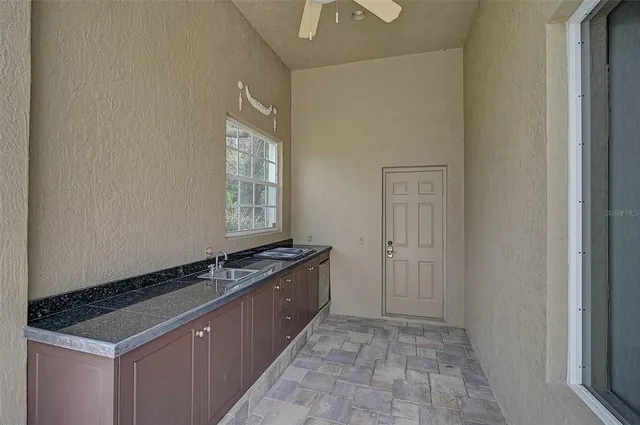 a kitchen that has a sink and a stove