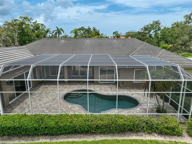 a view of house with a yard