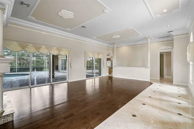 a view of an entryway with wooden floor