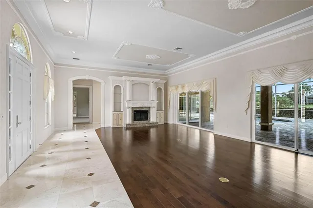 a view of an entryway with wooden floor
