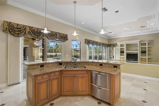 a kitchen with a sink stove and window