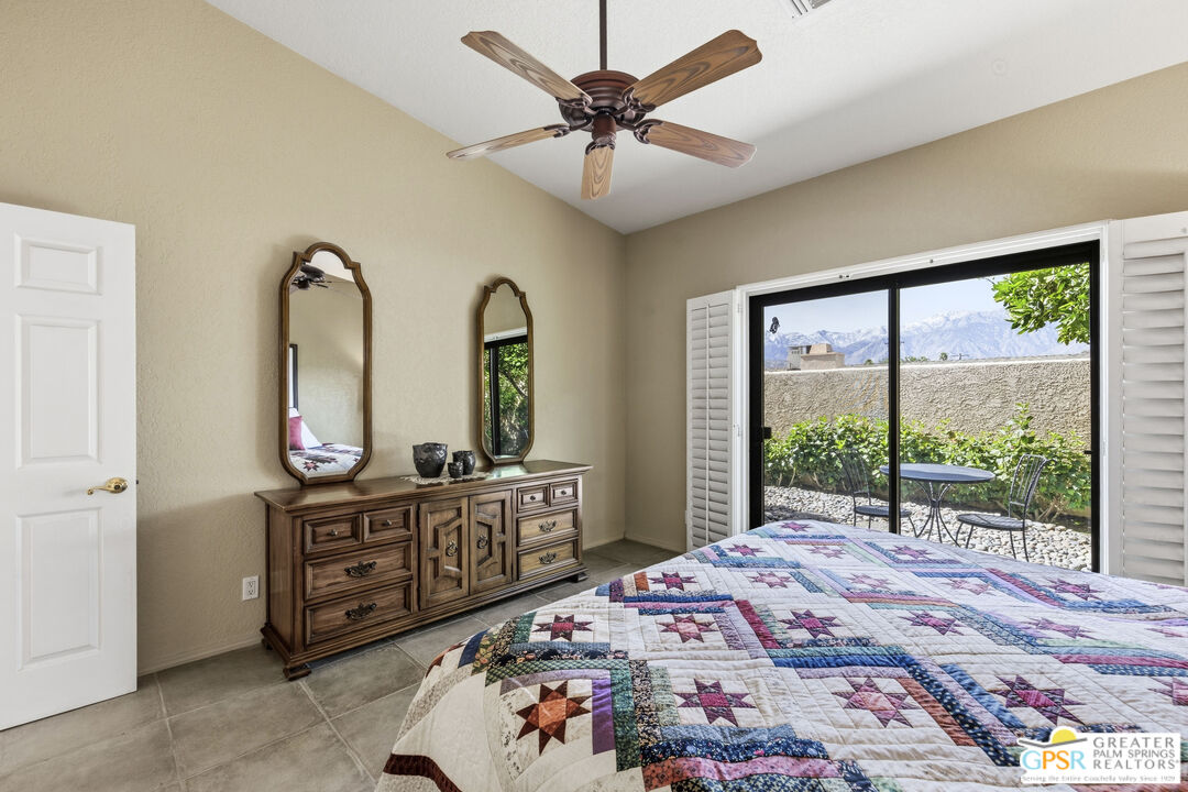 35127 Plumley Road Cathedral City, CA 92234 - Photo 15 of 32 a bed sitting in a bedroom next to a window