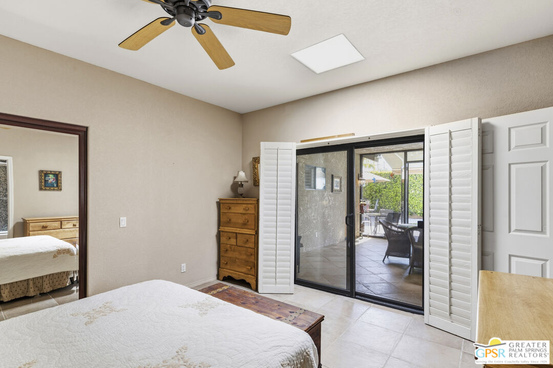 35127 Plumley Road Cathedral City, CA 92234 - Photo 20 of 32 a bedroom with a bed and a dresser