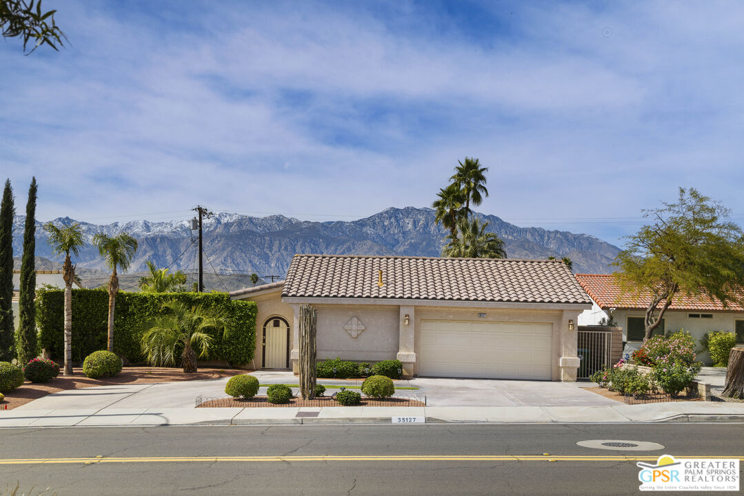 35127 Plumley Road Cathedral City, CA 92234 - Photo 2 of 32 a view of a house with a garden