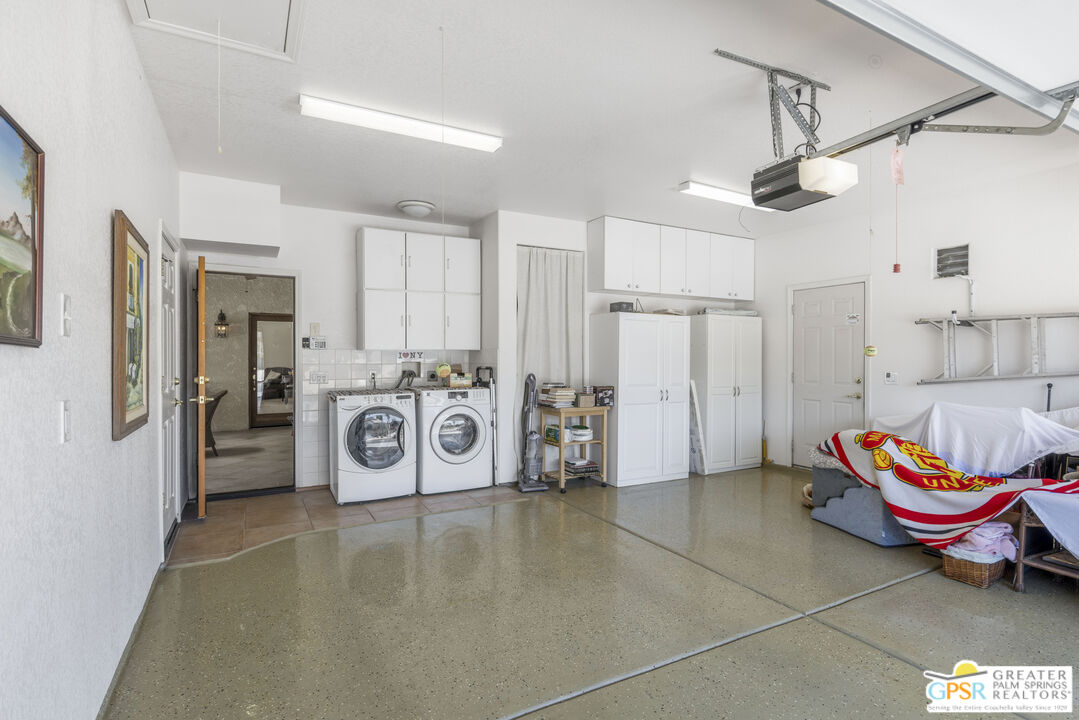 35127 Plumley Road Cathedral City, CA 92234 - Photo 27 of 32 a view of a storage & utility room with lots of appliances