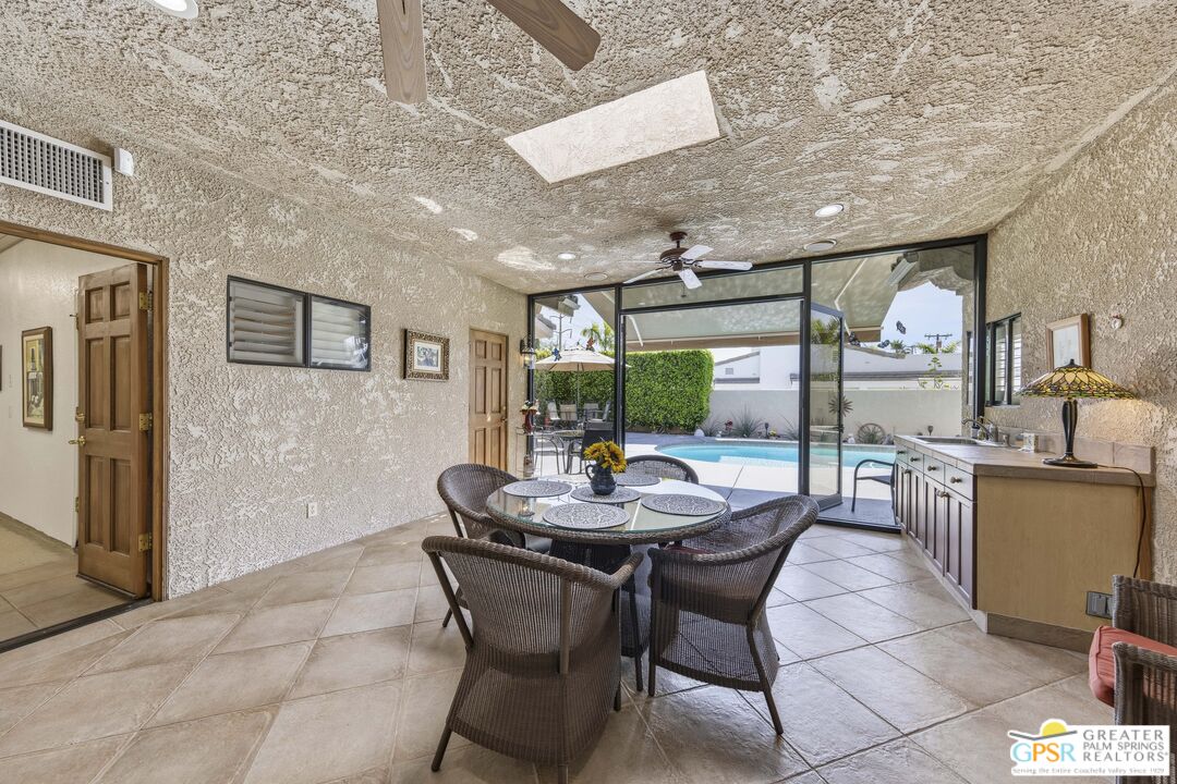 35127 Plumley Road Cathedral City, CA 92234 - Photo 6 of 32 a view of a dining room with furniture window and outside view
