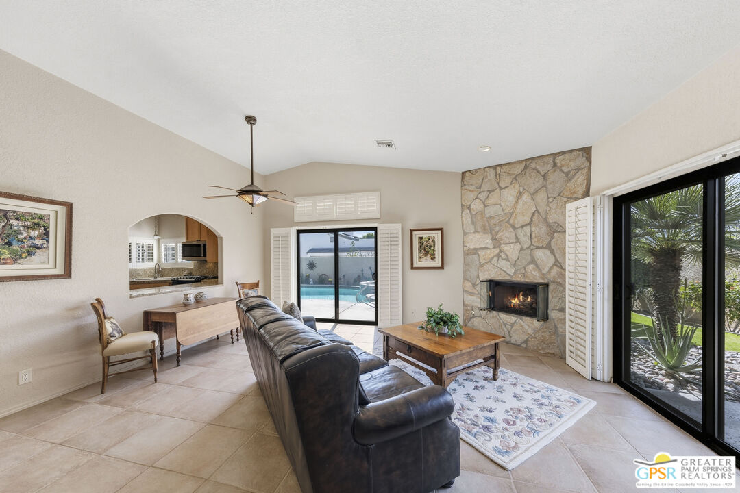 35127 Plumley Road Cathedral City, CA 92234 - Photo 8 of 32 a living room with furniture and a fireplace