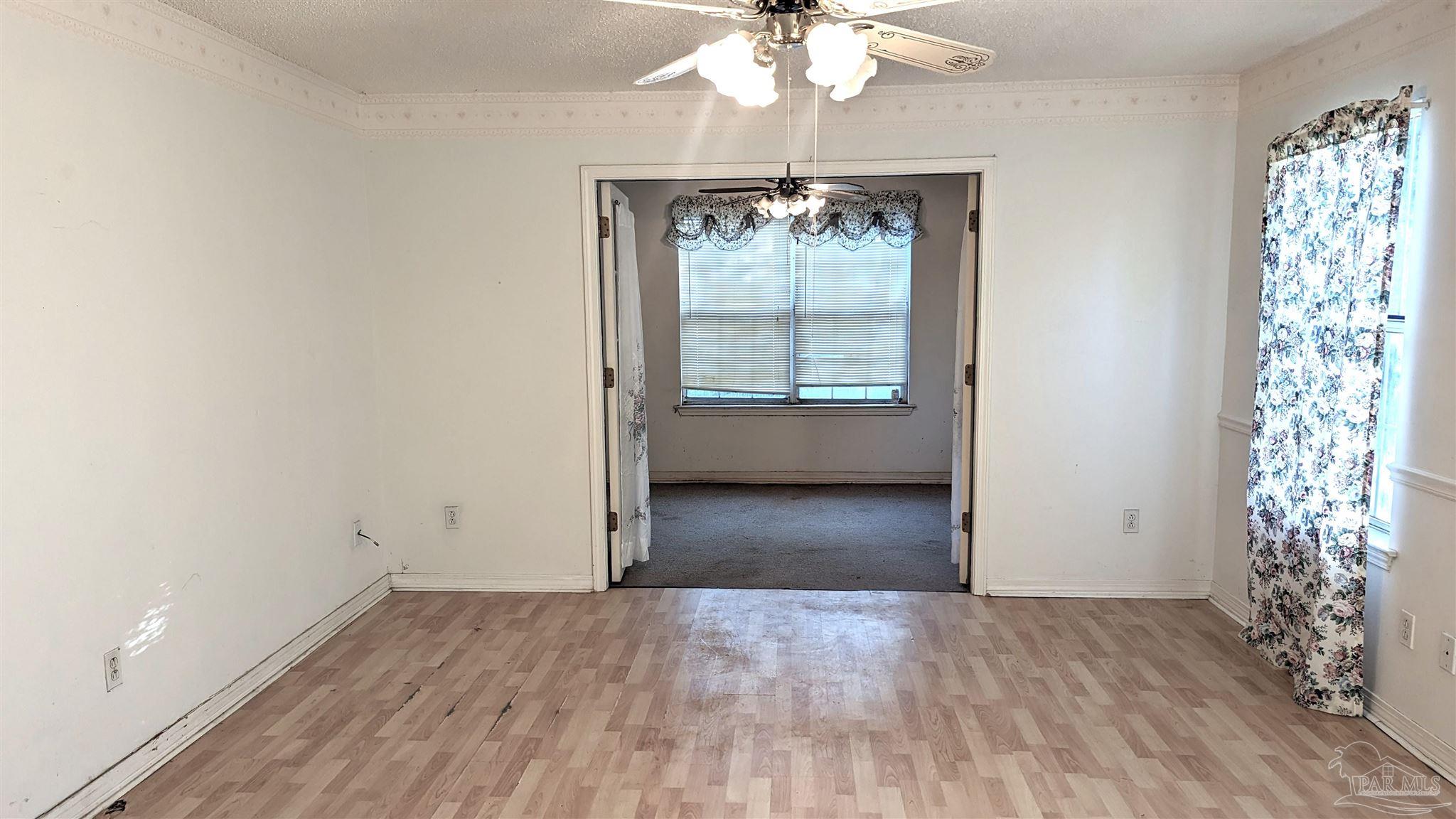 4312 Indiana Circle Pace, FL 32571 - Photo 16 of 21 Facing Sitting Room - Doors Open