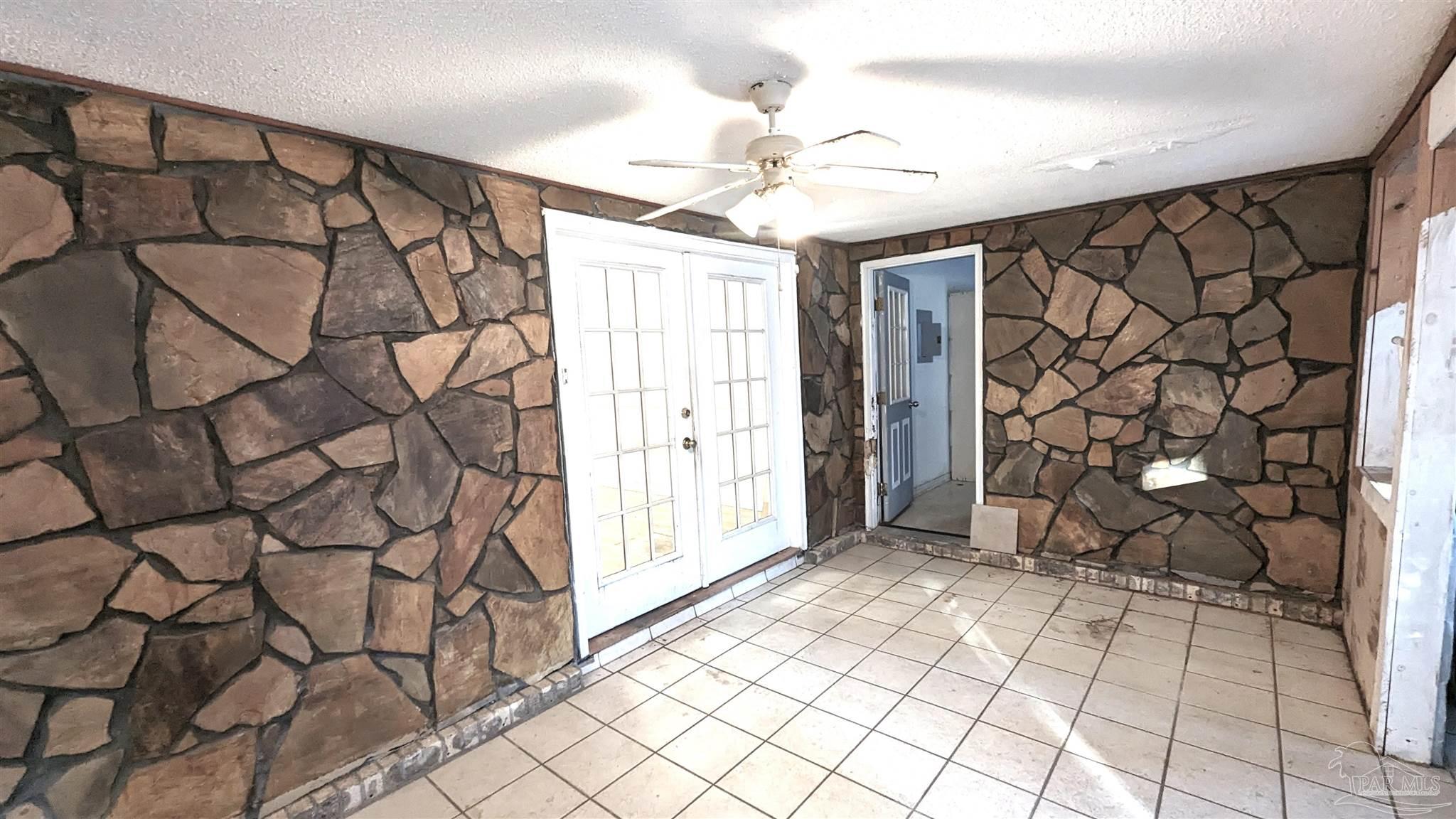 4312 Indiana Circle Pace, FL 32571 - Photo 19 of 21 Facing Laundry Room. Dining through French Doors