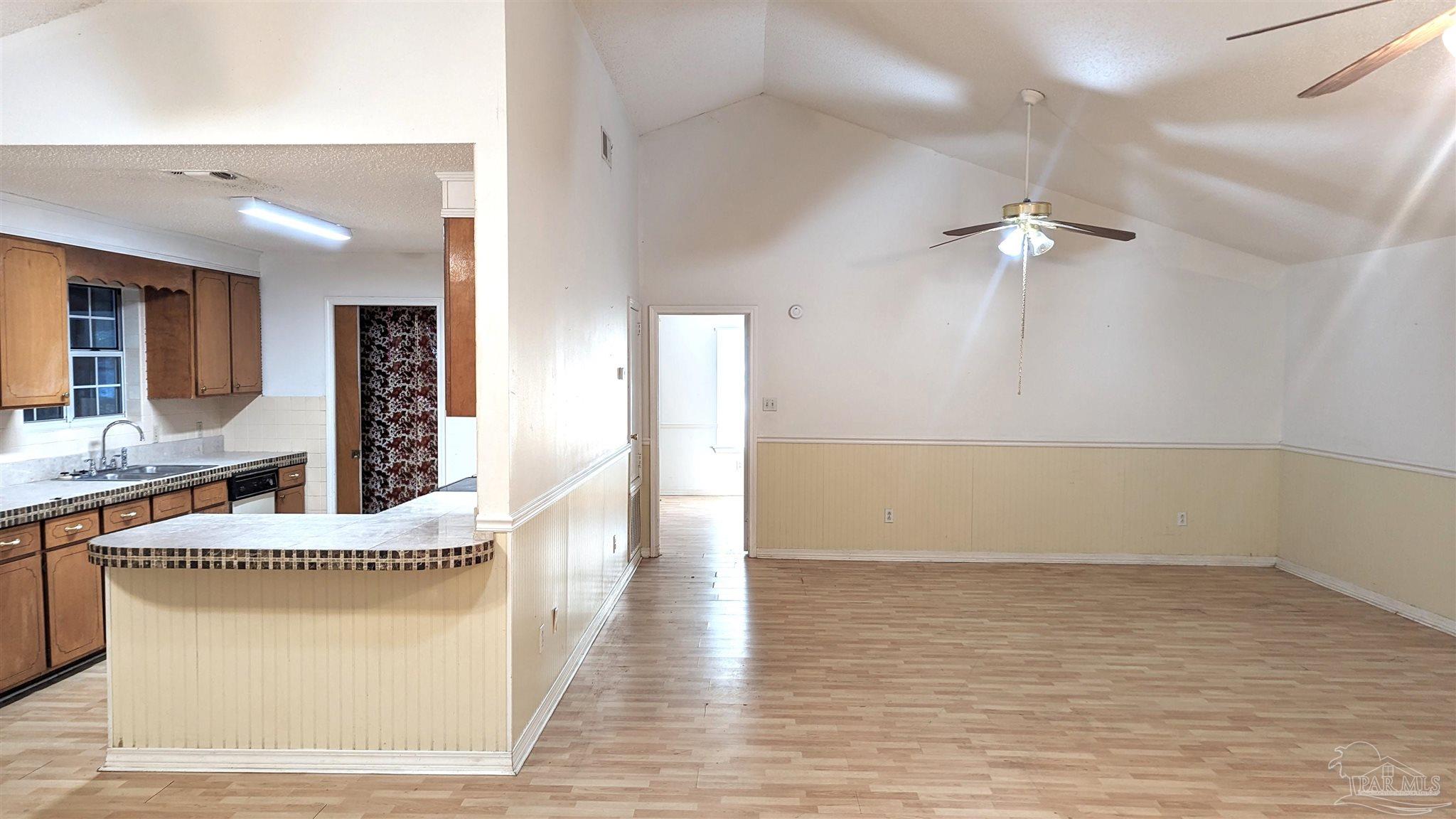 4312 Indiana Circle Pace, FL 32571 - Photo 3 of 21 View of Kitchen & Great Room from Dining Area
