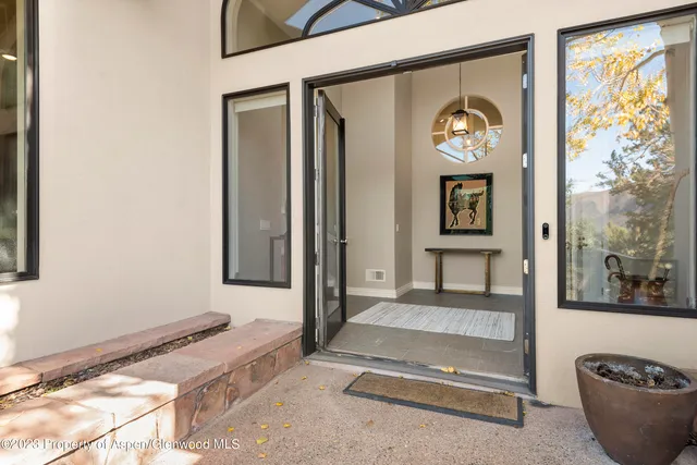 a view of a living room and entry way to room