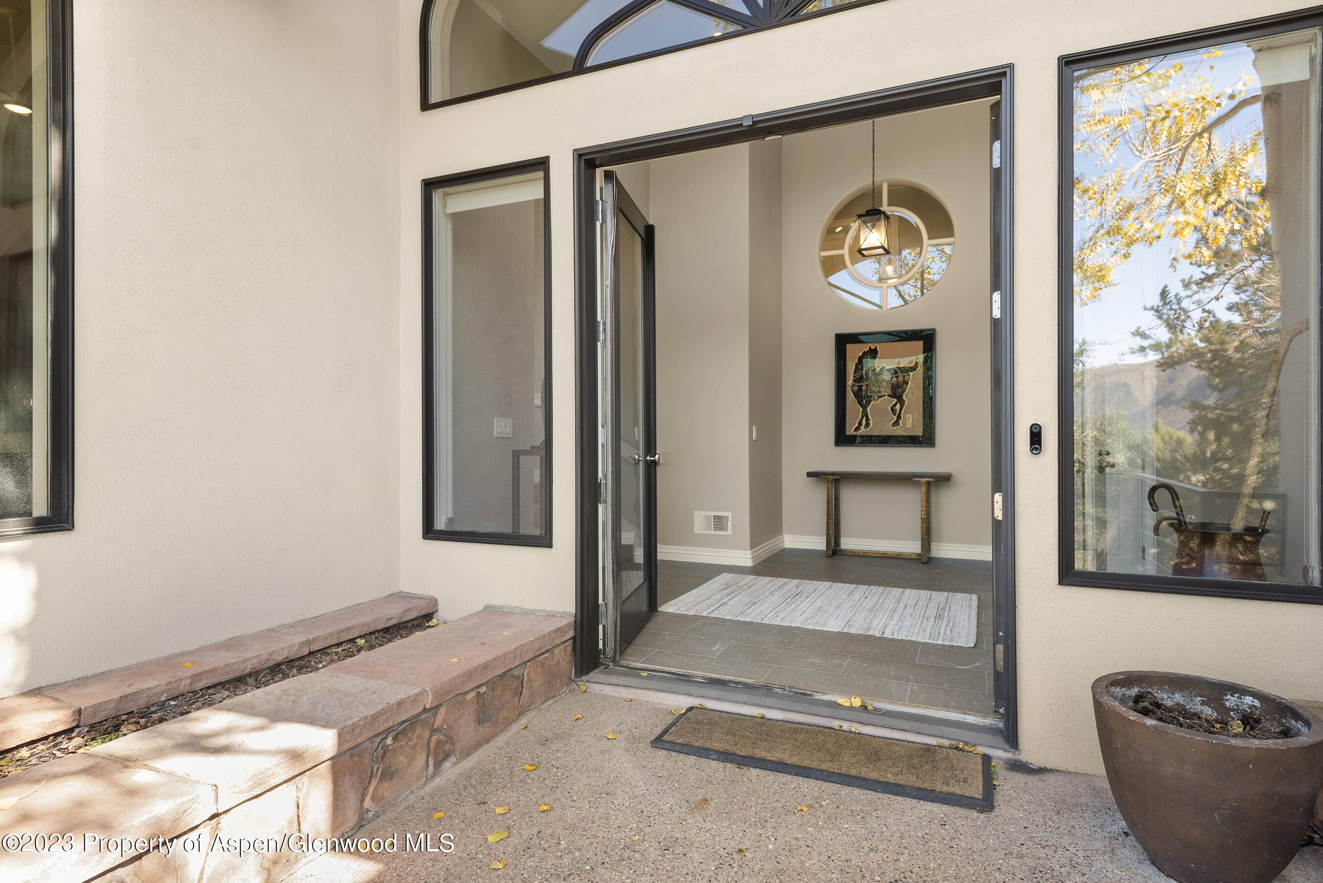 571 Booth Lane Basalt, CO 81621 - Photo 12 of 58 a front view of a house with a glass door and a window