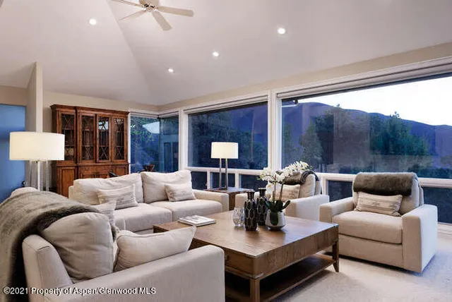 a living room with furniture and a large window