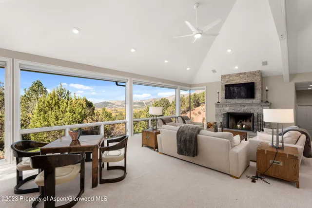 a view of a dining room with furniture window and outside view