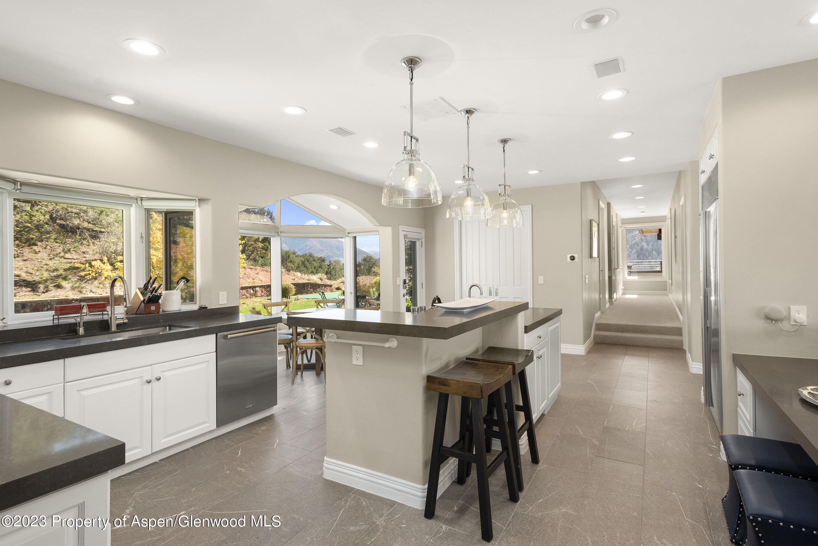 571 Booth Lane Basalt, CO 81621 - Photo 24 of 58 a kitchen with stainless steel appliances kitchen island granite countertop a sink and cabinets