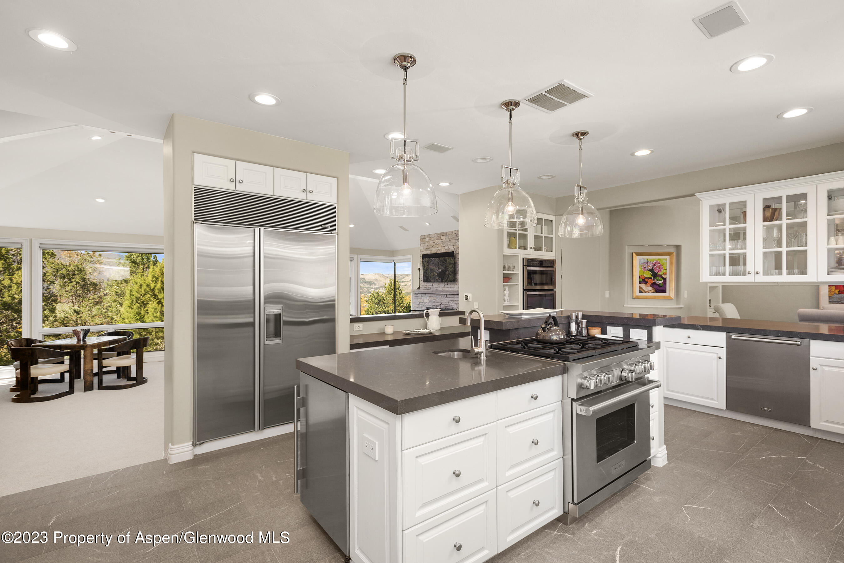571 Booth Lane Basalt, CO 81621 - Photo 25 of 58 a kitchen with stainless steel appliances granite countertop a sink a stove a refrigerator and island