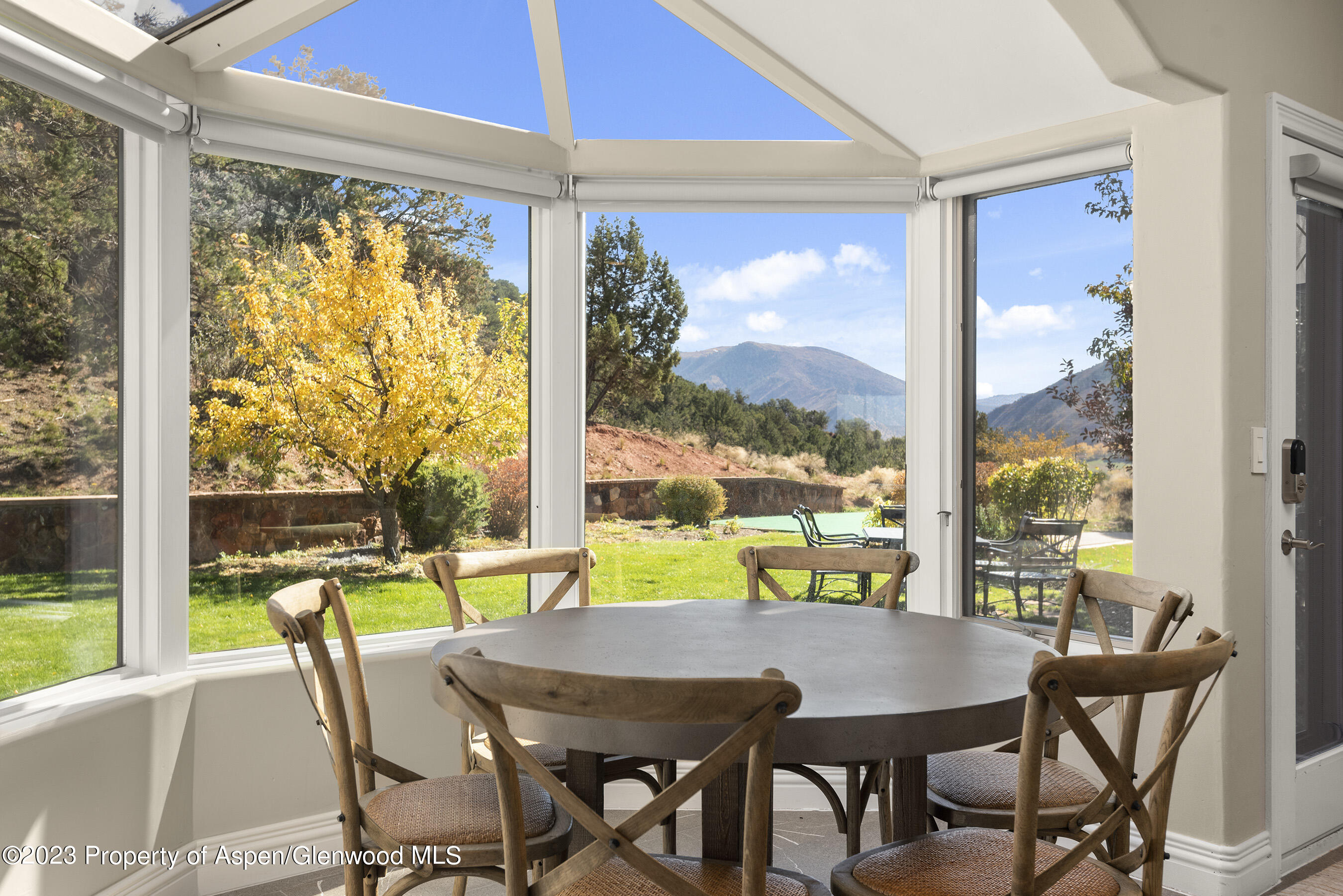 571 Booth Lane Basalt, CO 81621 - Photo 26 of 58 a view of a city from a dining room with a table and chairs