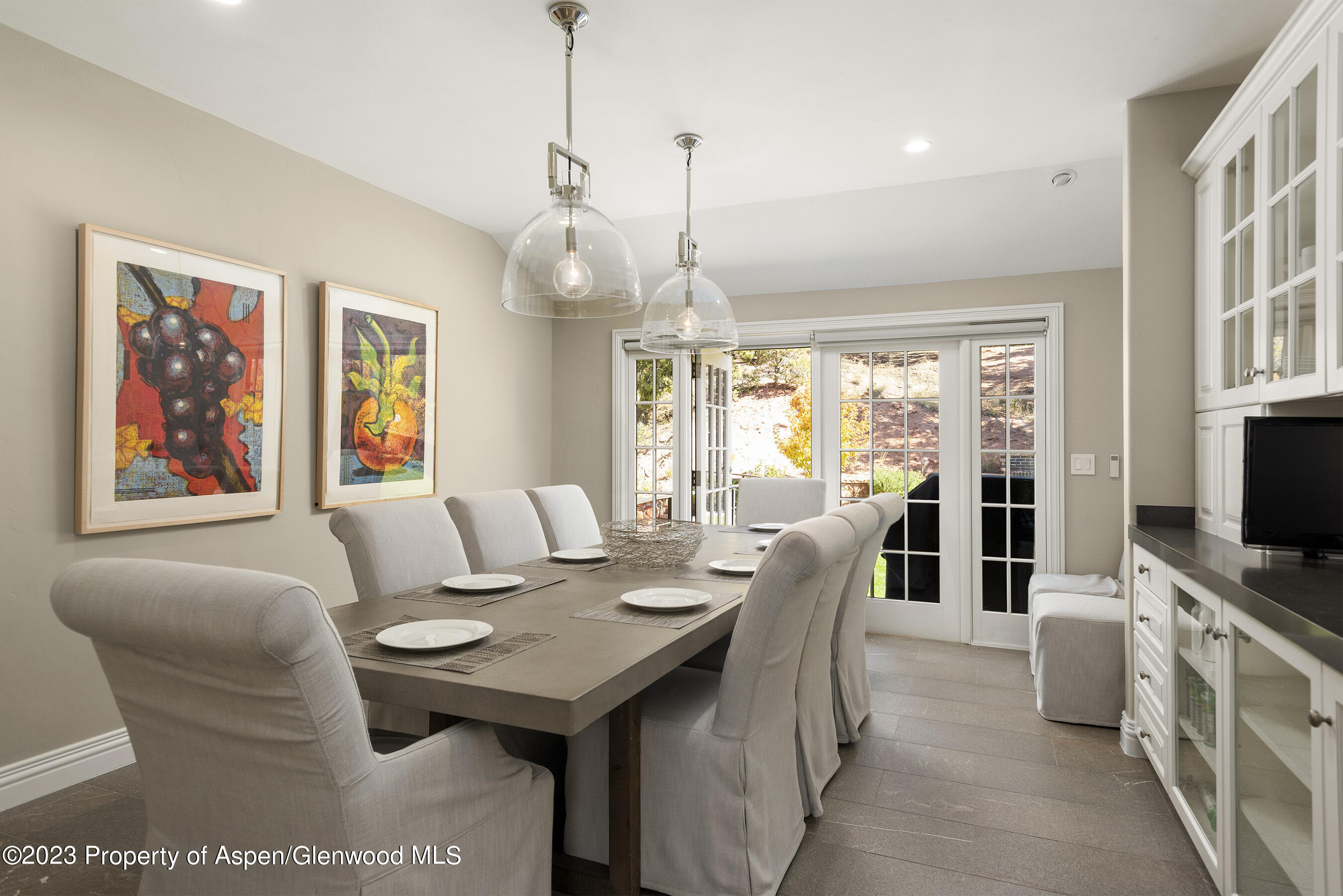 571 Booth Lane Basalt, CO 81621 - Photo 27 of 58 a living room with furniture a flat screen tv and a dining table