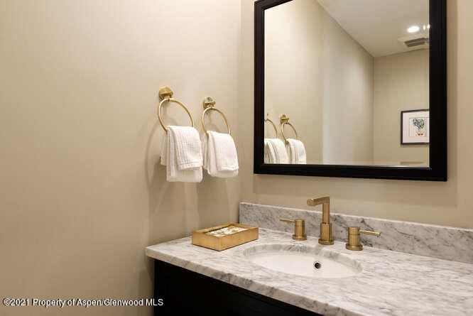 571 Booth Lane Basalt, CO 81621 - Photo 28 of 58 a bathroom with a sink vanity and a mirror