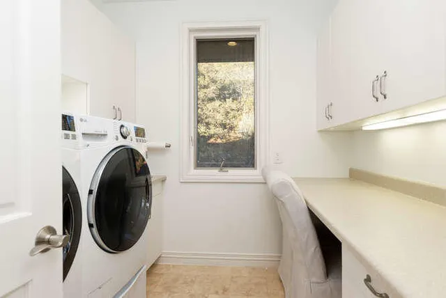 a spacious bathroom with a double vanity sink a mirror and a bathtub