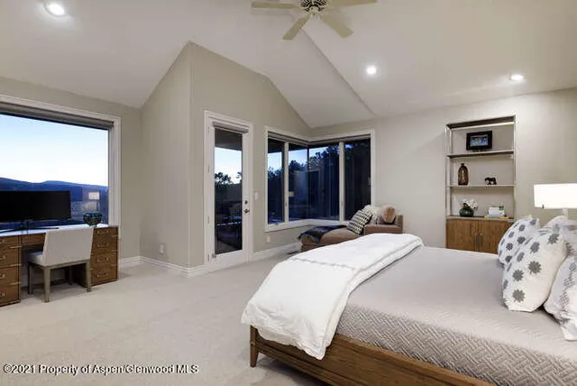 a bathroom with a double vanity sink mirror and shower