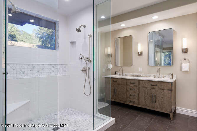 571 Booth Lane Basalt, CO 81621 - Photo 33 of 58 a bathroom with a double vanity sink mirror and shower