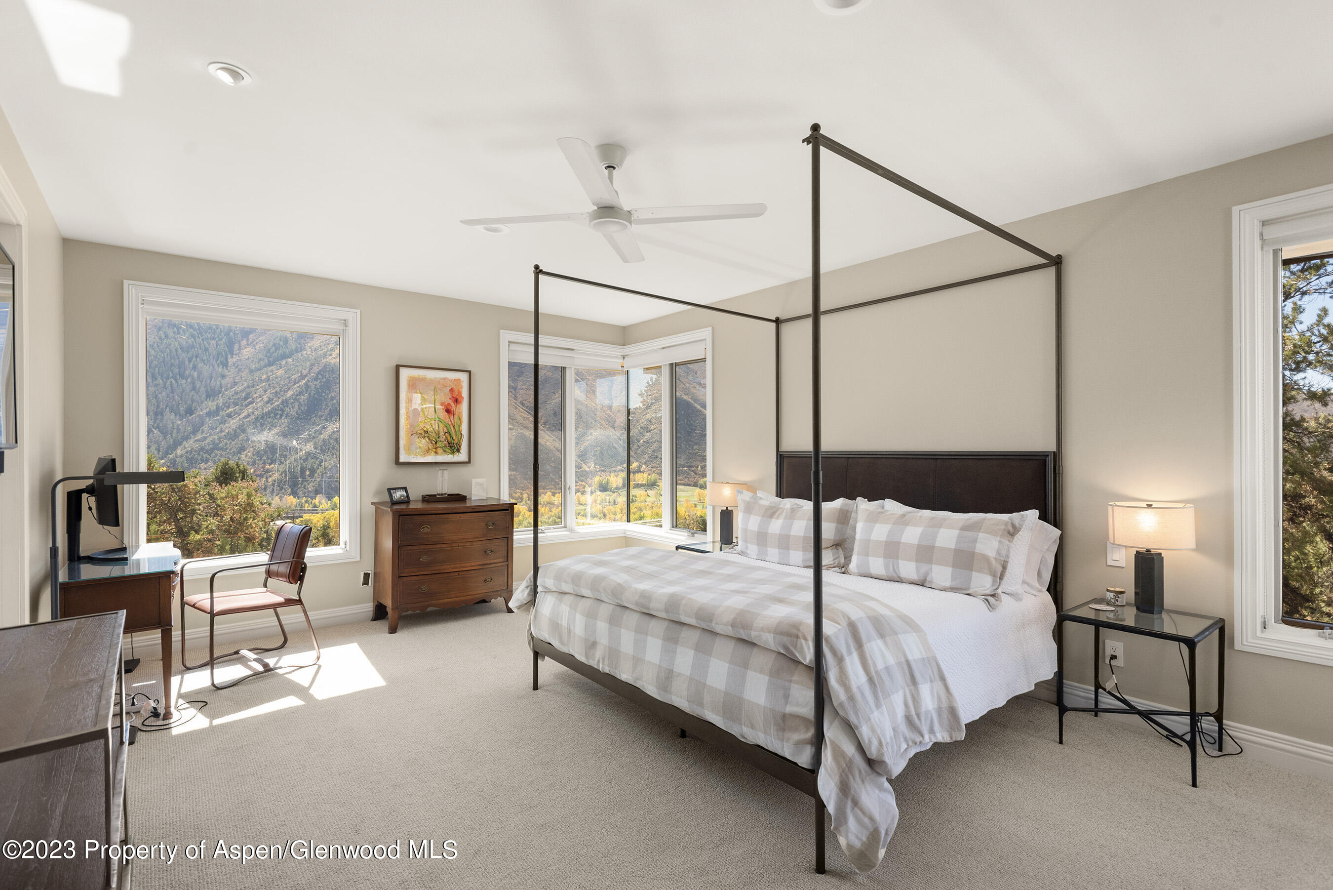 571 Booth Lane Basalt, CO 81621 - Photo 40 of 58 a bedroom with a bed couch and large window