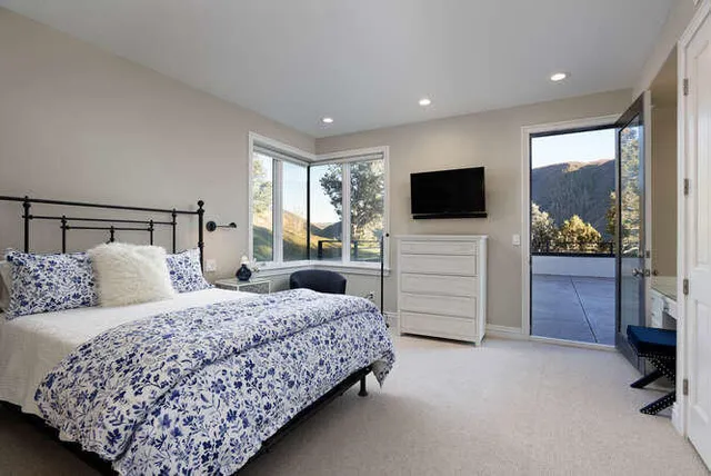 a room with pool table and a flat screen tv