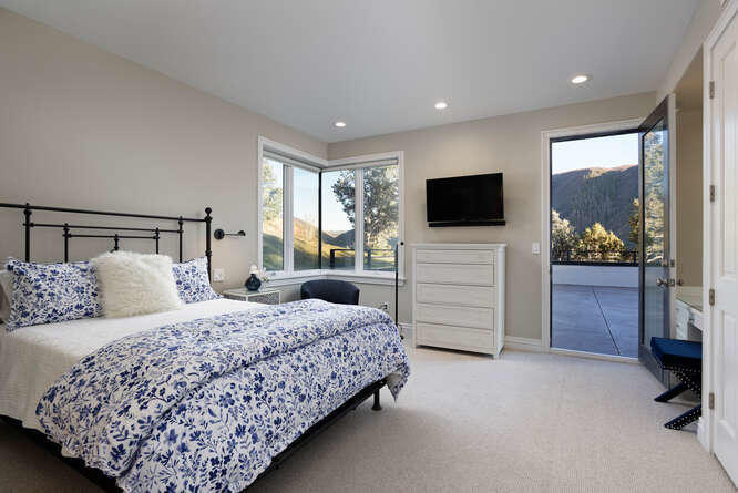 571 Booth Lane Basalt, CO 81621 - Photo 45 of 58 a bedroom with a bed and a flat screen tv