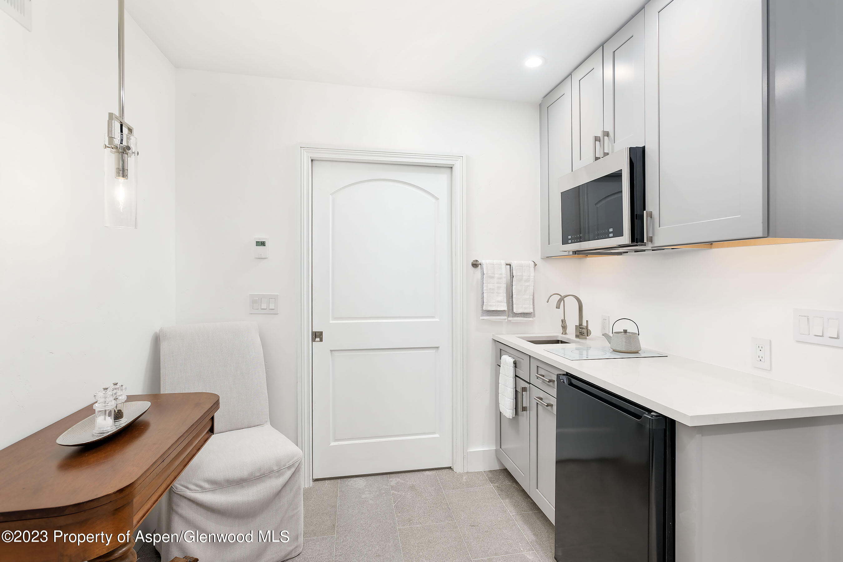 571 Booth Lane Basalt, CO 81621 - Photo 55 of 58 a bathroom with a granite countertop sink a toilet and a mirror