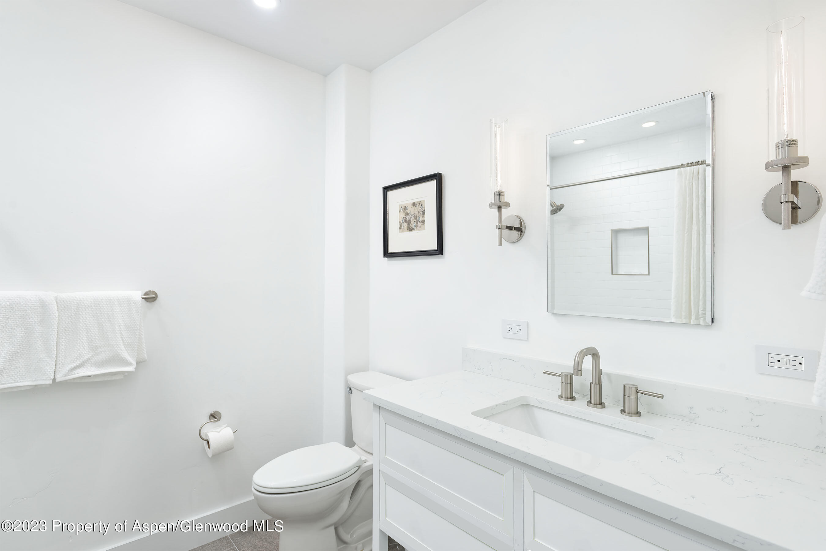 571 Booth Lane Basalt, CO 81621 - Photo 56 of 58 a white toilet sitting next to a bathroom sink