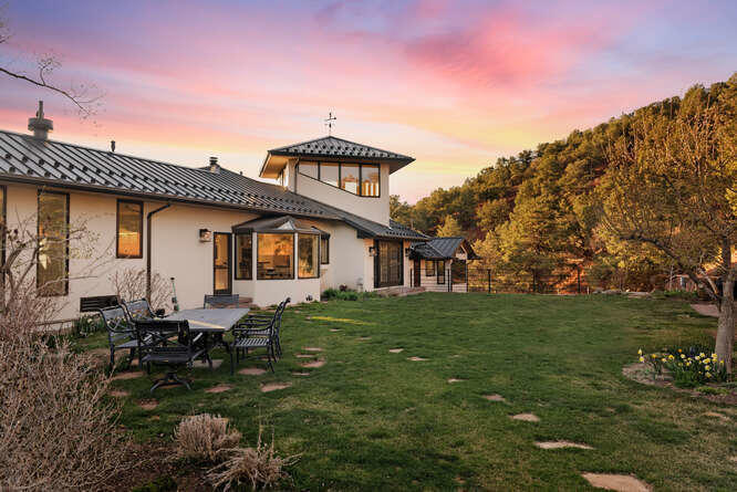 571 Booth Lane Basalt, CO 81621 - Photo 9 of 58 a backyard of a house with table and chairs