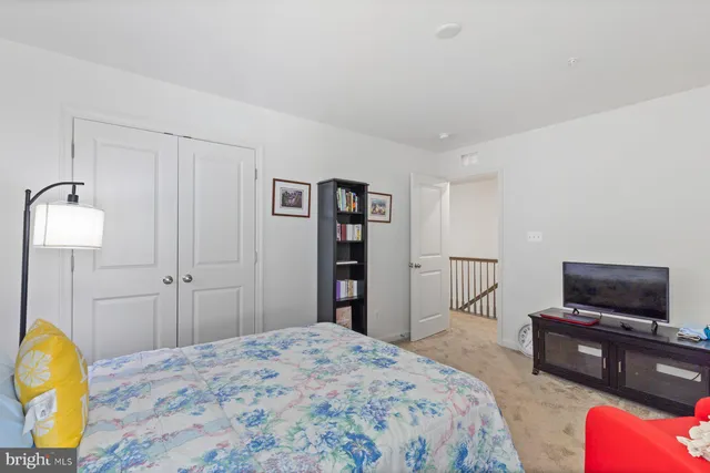 a bedroom with a bed and a television in it